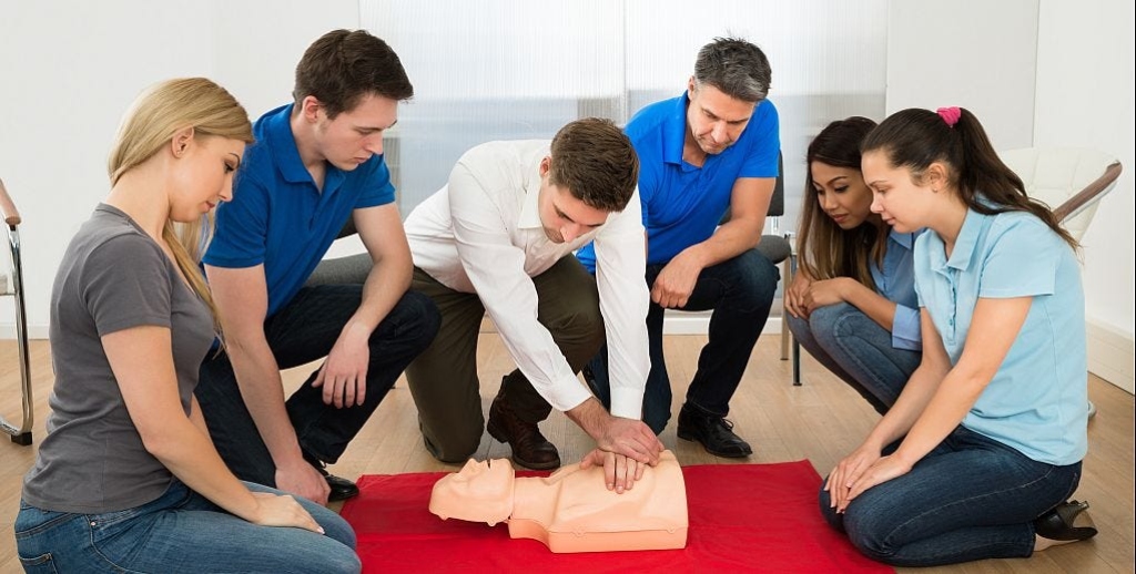 staff participating in a hands-on emergency training session